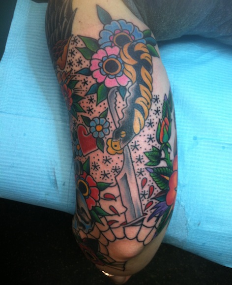 Straight Razor and Flowers Tattoo done by Tony Sellers.